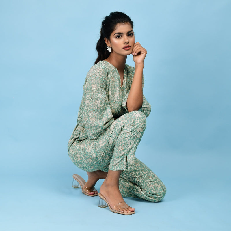 Right View of a Model wearing Sage Green Block Printed Ankle Length Cotton Jumpsuit