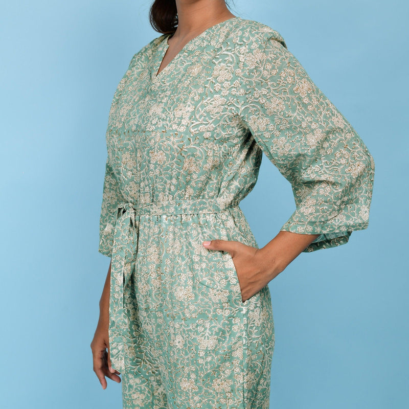 Front Detail of a Model wearing Sage Green Block Printed 100% Cotton Straight Jumpsuit