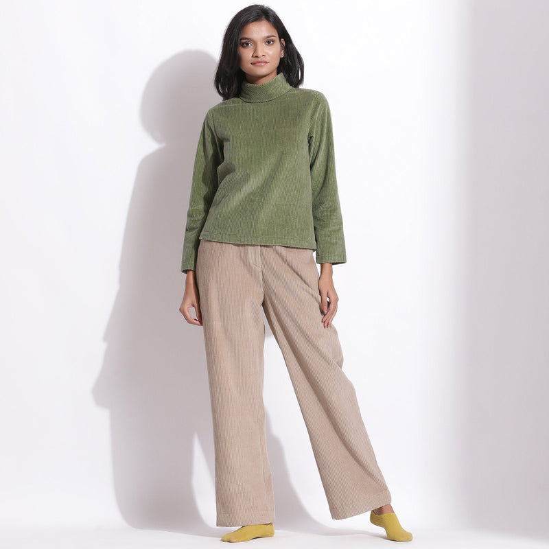 Front View of a Model wearing Sage Green Warm Cotton Corduroy High Neck Top