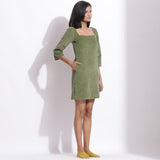 Right View of a Model wearing Sage Green Cotton Corduroy Square Neck Dress