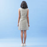 Back View of a Model wearing Sage Green Floral Block Printed Cotton Short Dress