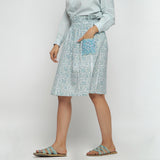 Left View of a Model wearing Sage Green Block Printed Cotton Knee Length Skirt