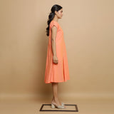 Right View of a Model wearing Salmon Pink Mangalgiri Cotton Button-Down Midi Dress