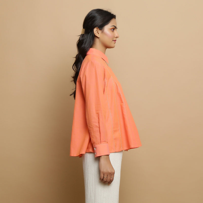Right View of a Model wearing Salmon Pink Cotton Solid Godet Top