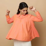 Front View of a Model wearing Salmon Pink Cotton Solid Godet Top