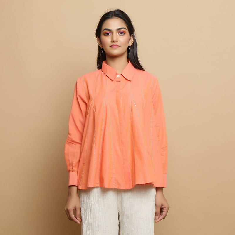 Front View of a Model wearing Salmon Pink Cotton Solid Godet Top