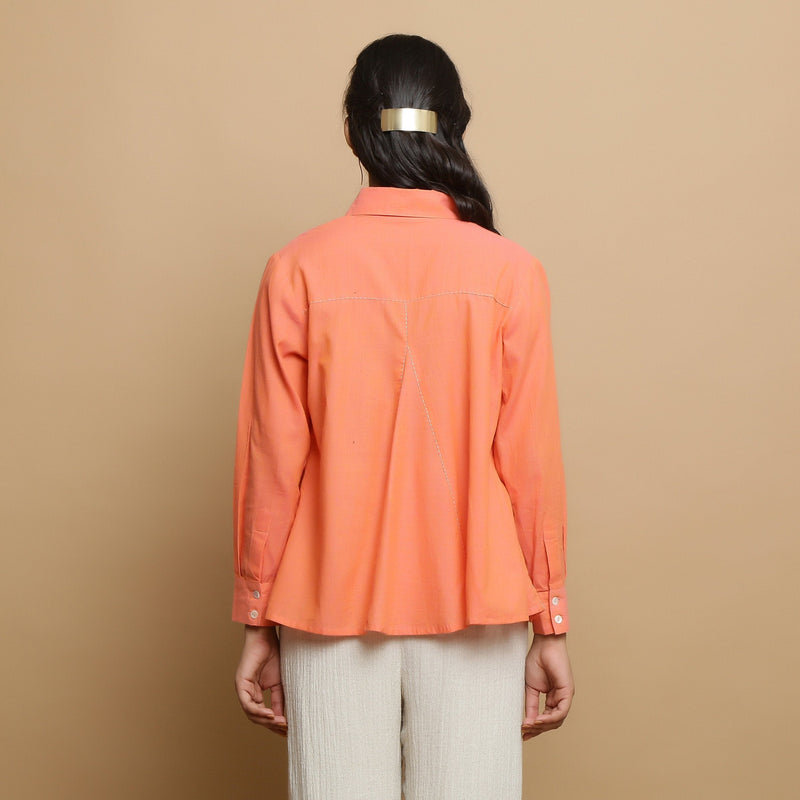 Back View of a Model wearing Salmon Pink Cotton Solid Godet Top
