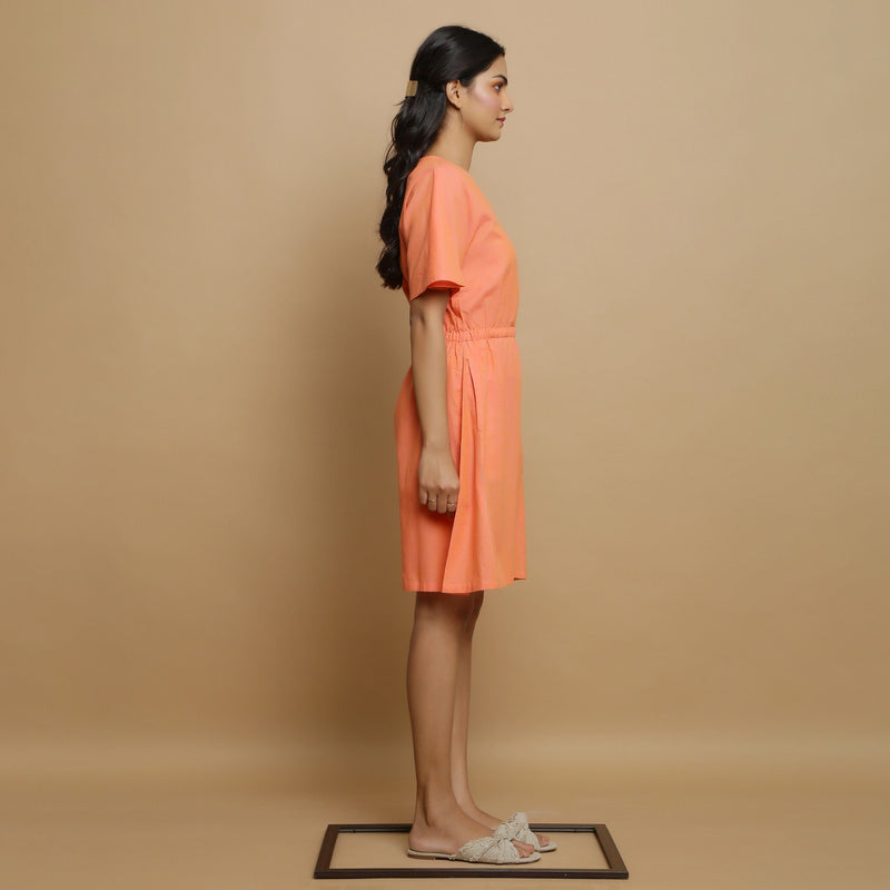 Right View of a Model wearing Salmon Pink Button-Down Godet Jumpsuit