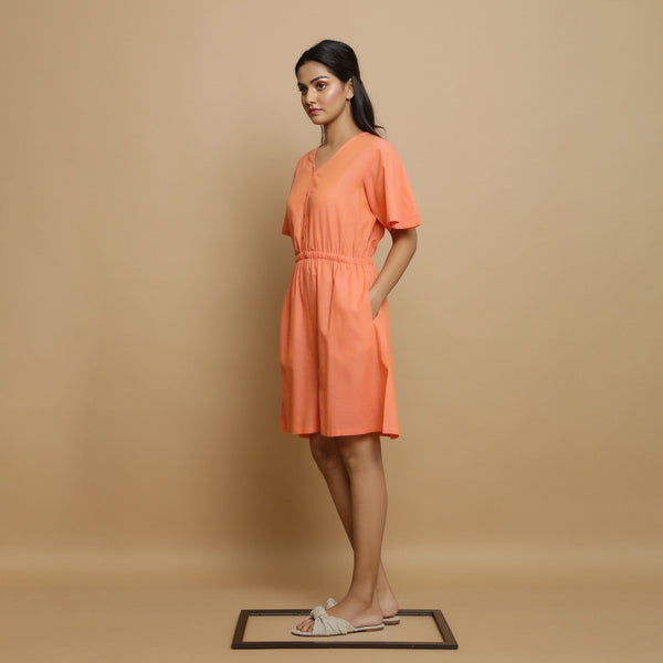 Left View of a Model wearing Salmon Pink Button-Down Godet Jumpsuit
