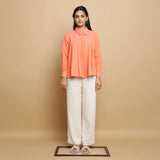 Front View of a Model wearing Salmon Pink Godet Top and Undyed Pant Set
