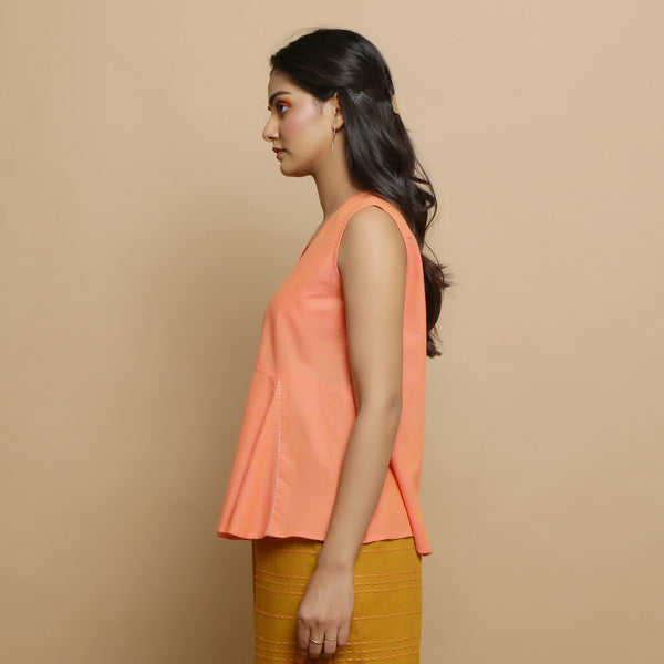 Left View of a Model wearing Salmon Pink Hand-Embroidered Flared Top