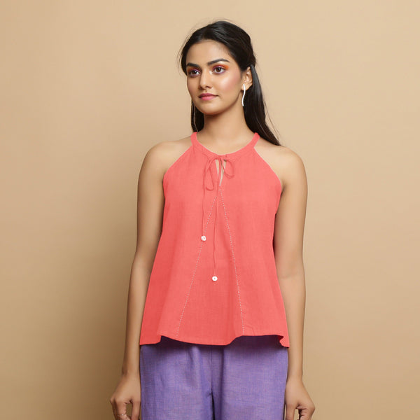 Front View of a Model wearing Salmon Pink Hand-Embroidered Halter Neck Top