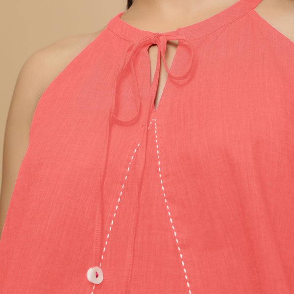 Front Detail of a Model wearing Salmon Pink Hand-Embroidered Halter Neck Top