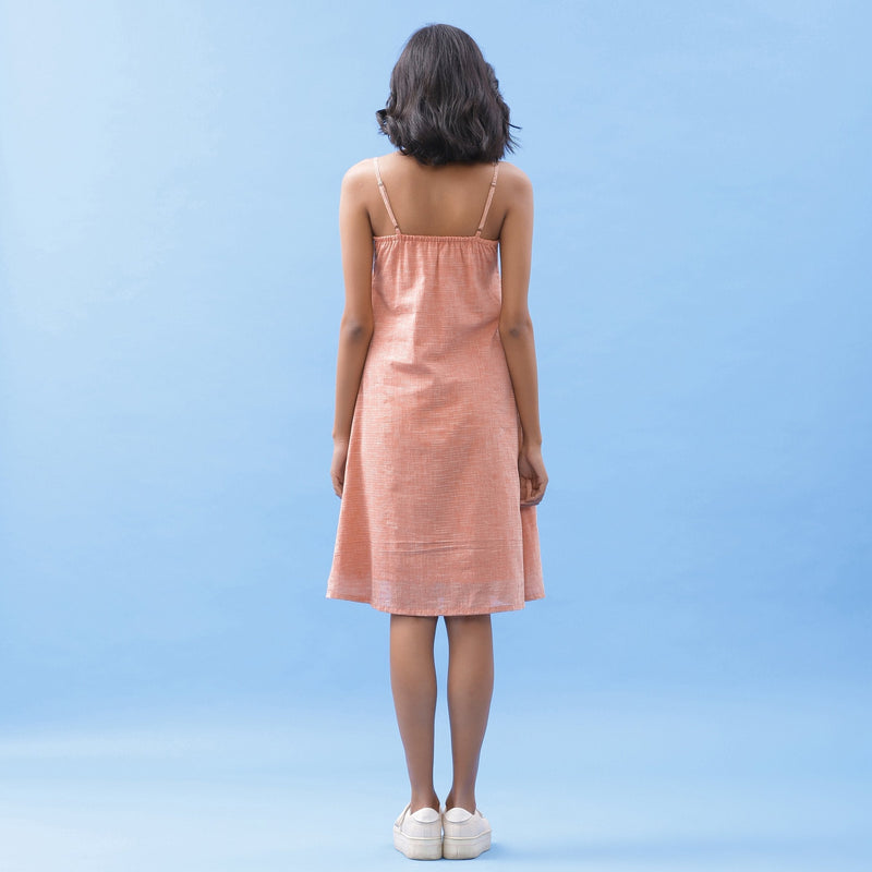 Back View of a Model wearing Salmon Pink Handspun Cotton Strap Slit Dress