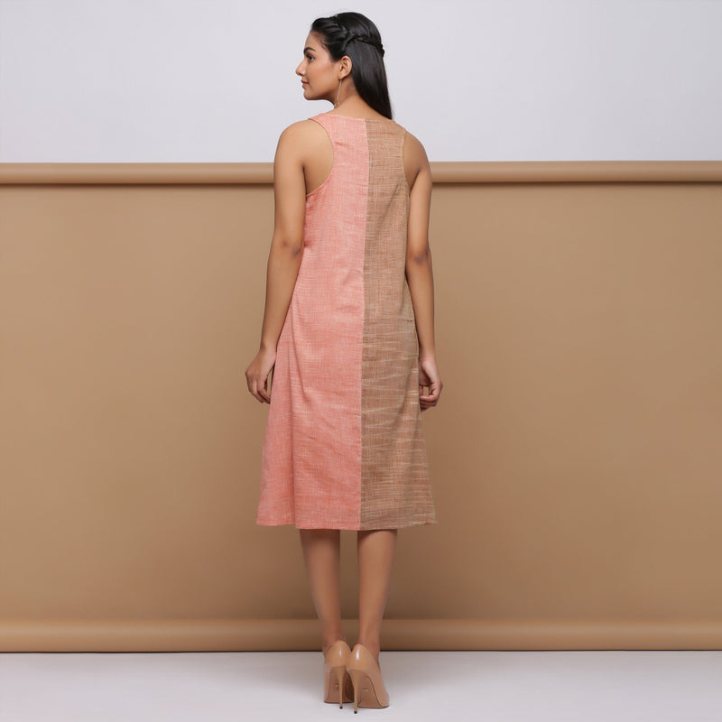 Back View of a Model wearing Salmon Pink Handspun Racer Back A-Line Dress