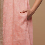 Front Detail of a Model wearing Salmon Pink Handspun Racer Back A-Line Dress