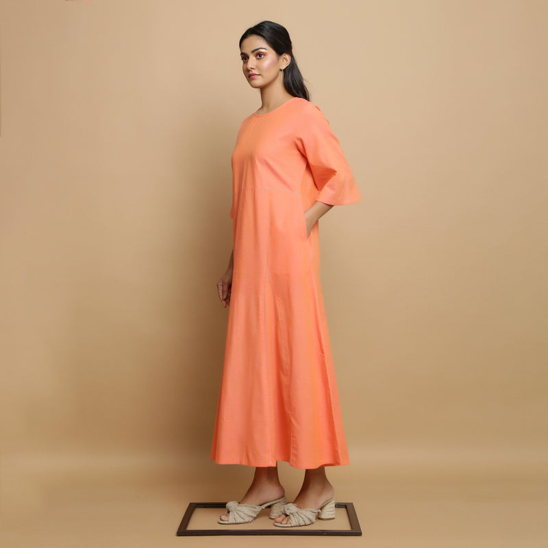 Left View of a Model wearing Salmon Pink Mangalgiri Cotton Godet Maxi Dress
