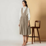 Left View of a Model wearing Sand Beige Cotton Flax Pinafore Midi Wrap Dress