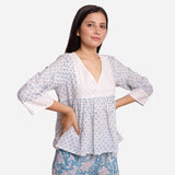 Right View of a Model wearing White Cotton Block Printed Floral V-Neck Top