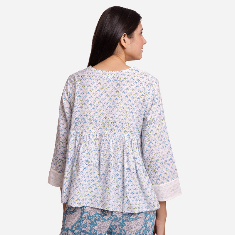 Back View of a Model wearing White Cotton Block Printed Floral V-Neck Top
