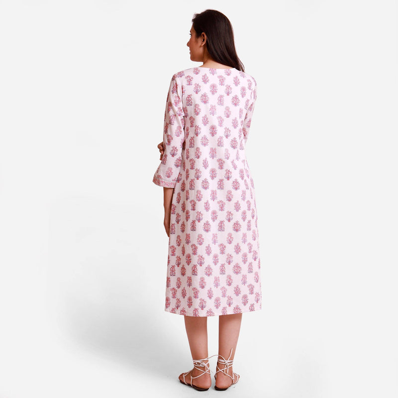 Back View of a Model wearing Floral Block Printed White Wrap Dress