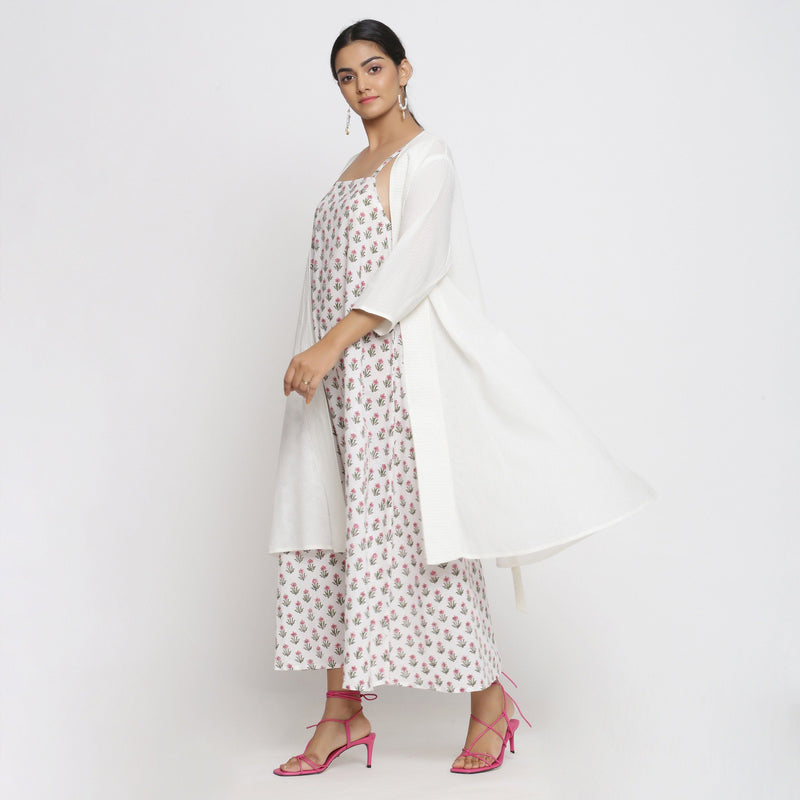 Left View of a Model wearing Sanganeri Print Dress and White Overlay Set