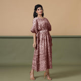 Right View of a Model wearing Sangria Wine Shibori Kaftan Dress