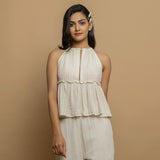 Front View of a Model wearing Ecru Cotton Flax Sleeveless Flared Top