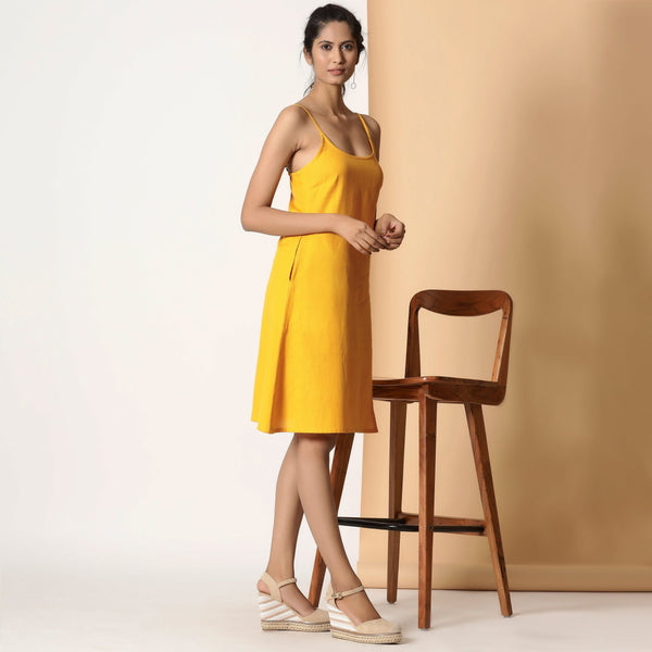 Right View of a Model wearing Sassy Yellow Cotton Flax Strappy Slit Dress