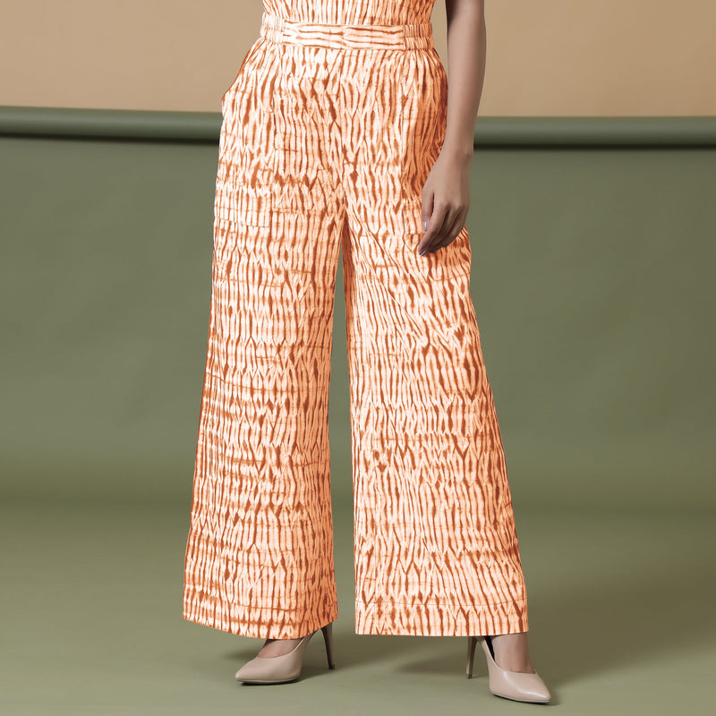 Front View of a Model wearing Sunset Orange Shibori Wide Legged Pant