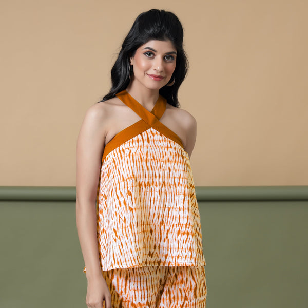 Front View of a Model wearing Shibori Halter Neck Flared Top