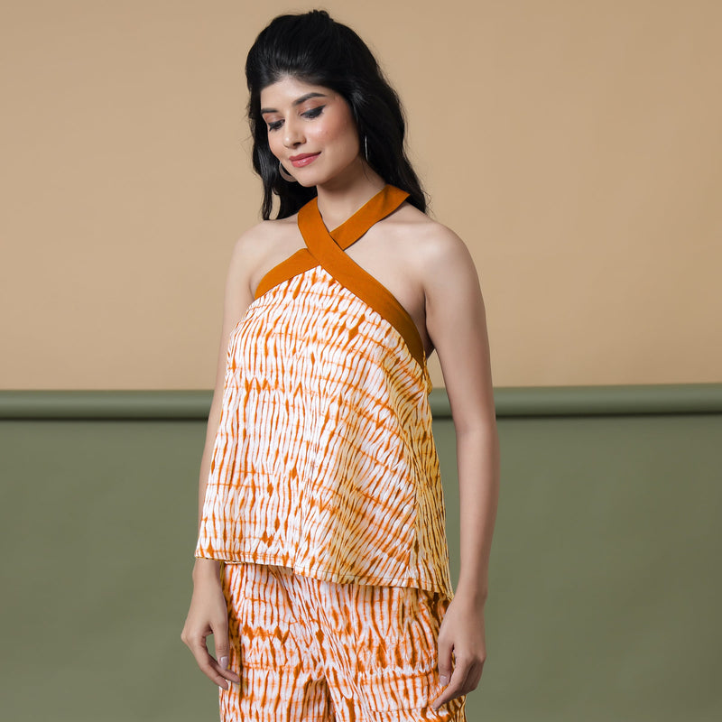 Left View of a Model wearing Shibori Halter Neck Flared Top