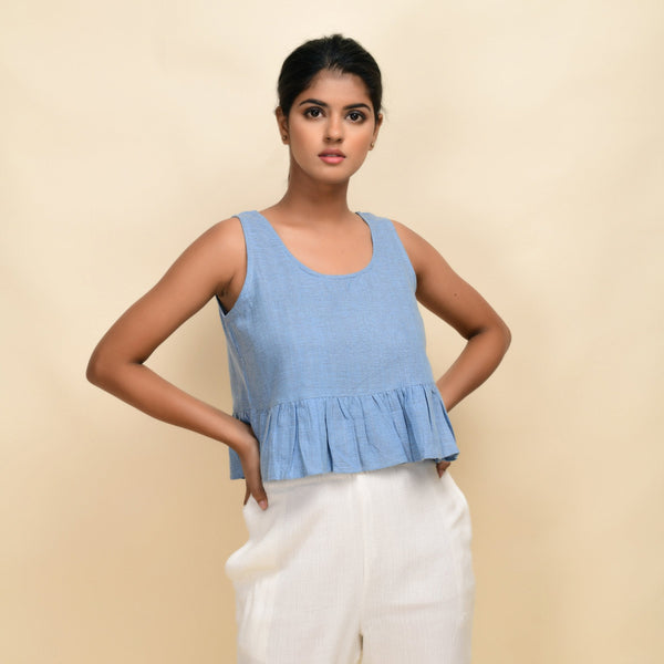 Front View of a Model wearing Sky Blue Handwoven 100% Cotton Peplum Top