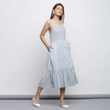 Right View of a Model wearing Sky Blue Tiered Yarn Dyed Striped Dress