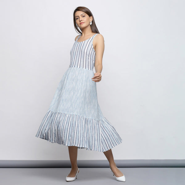 Left View of a Model wearing Sky Blue Tiered Yarn Dyed Striped Dress