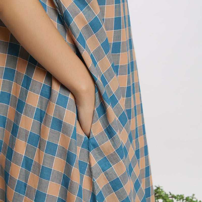 Right Detail of a Model wearing Soft Handspun Cotton Muslin Flared Dress