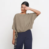 Front View of a Model wearing Solid Beige Cotton Flax Blouson Top