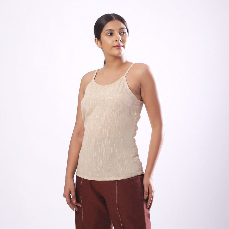 Left View of a Model wearing Solid Beige Cotton Flax Spaghetti Top