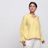 Front View of a Model wearing Yellow Hand Tie Dyed Shirred Blouson Top