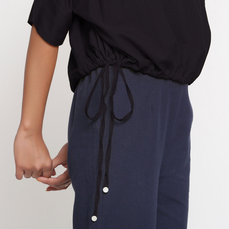 Right Detail of a Model wearing Solid Black Cotton Flax Blouson Top