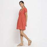 Left View of a Model wearing Brick Red Cotton Solid Wrap Dress