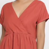 Front Detail of a Model wearing Brick Red Cotton Solid Wrap Dress