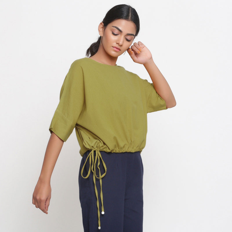 Right View of a Model wearing Solid Green Cotton Flax Blouson Top