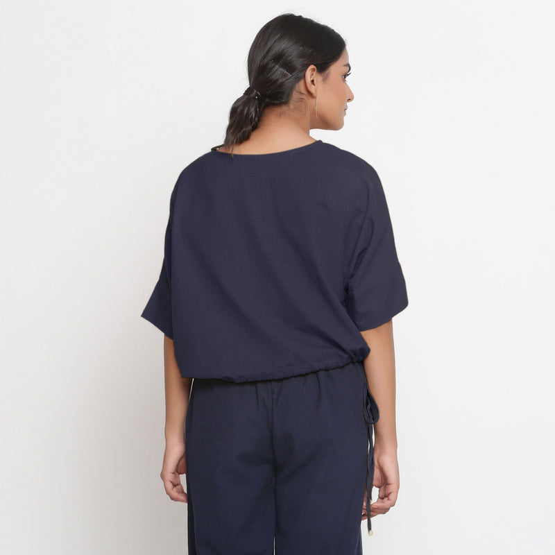 Back View of a Model wearing Solid Navy Blue Cotton Flax Blouson Top