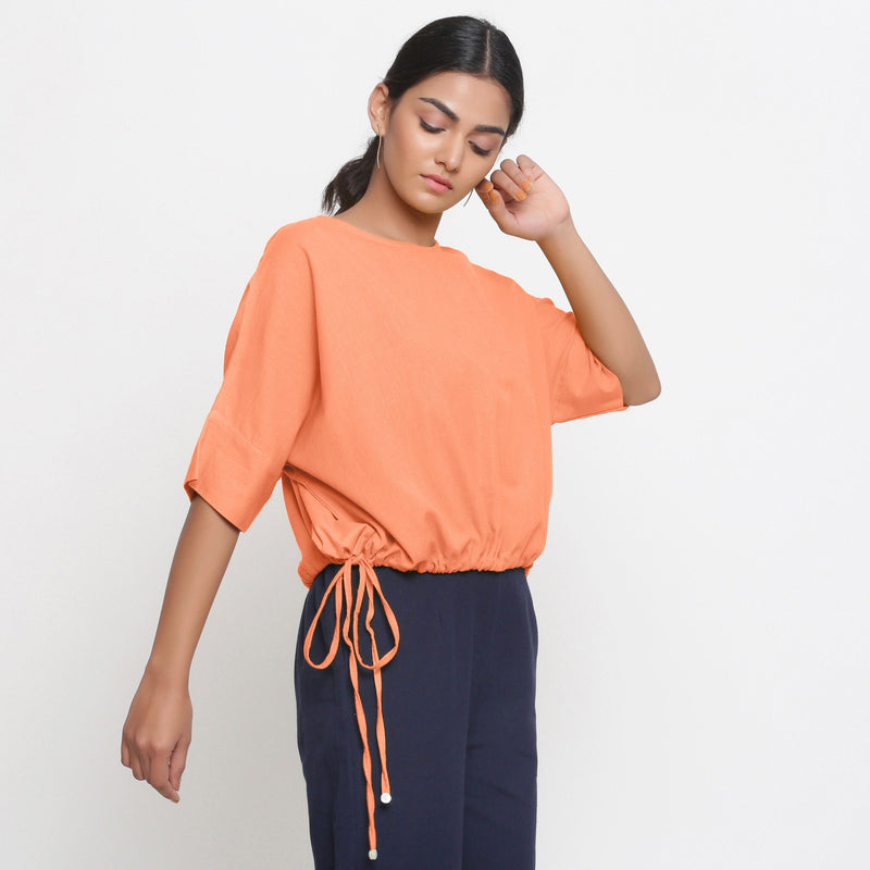 Right View of a Model wearing Solid Peach Cotton Flax Blouson Top