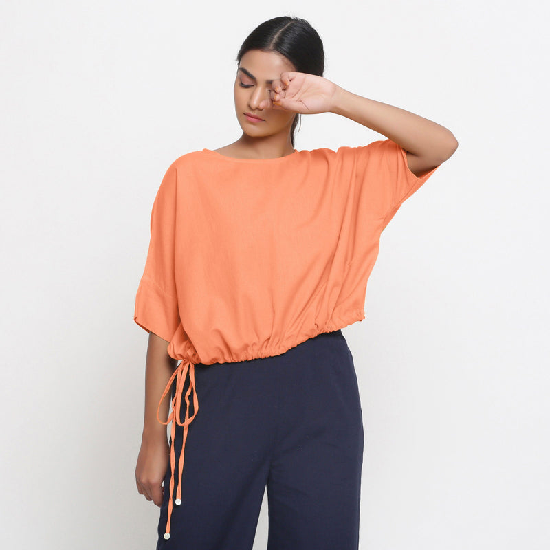 Front View of a Model wearing Solid Peach Cotton Flax Blouson Top