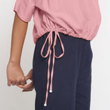 Right Detail of a Model wearing Solid Pink Cotton Flax Blouson Top
