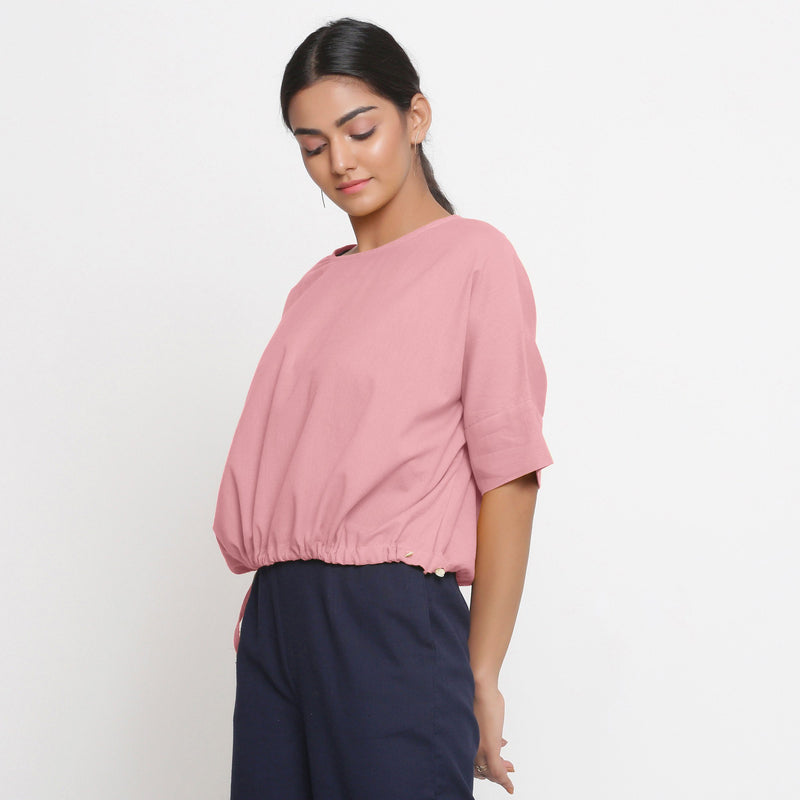 Left View of a Model wearing Solid Pink Cotton Flax Blouson Top