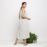 Back View of a Model wearing Strappy Handspun Flared Maxi Dress