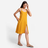 Right View of a Model wearing Mustard Cotton Flax Strappy Slit Dress